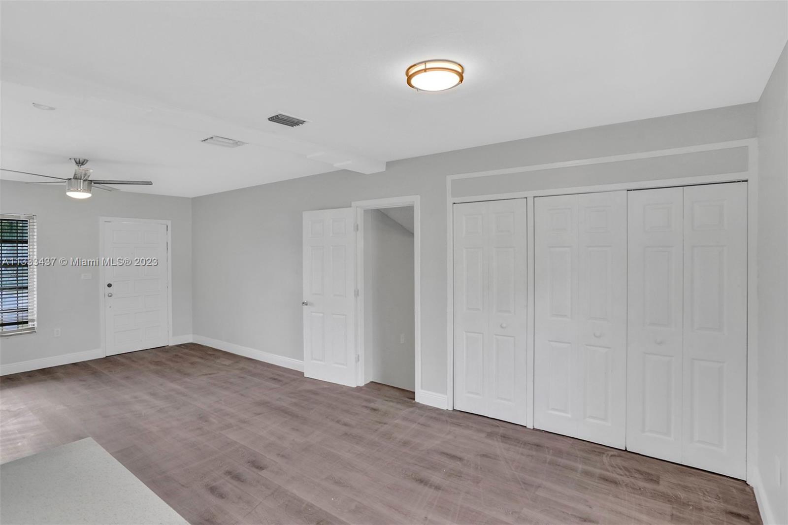 1101 Northwest 147th Street Miami, FL 33168 - Photo 10 of 45 wooden floor in an empty room