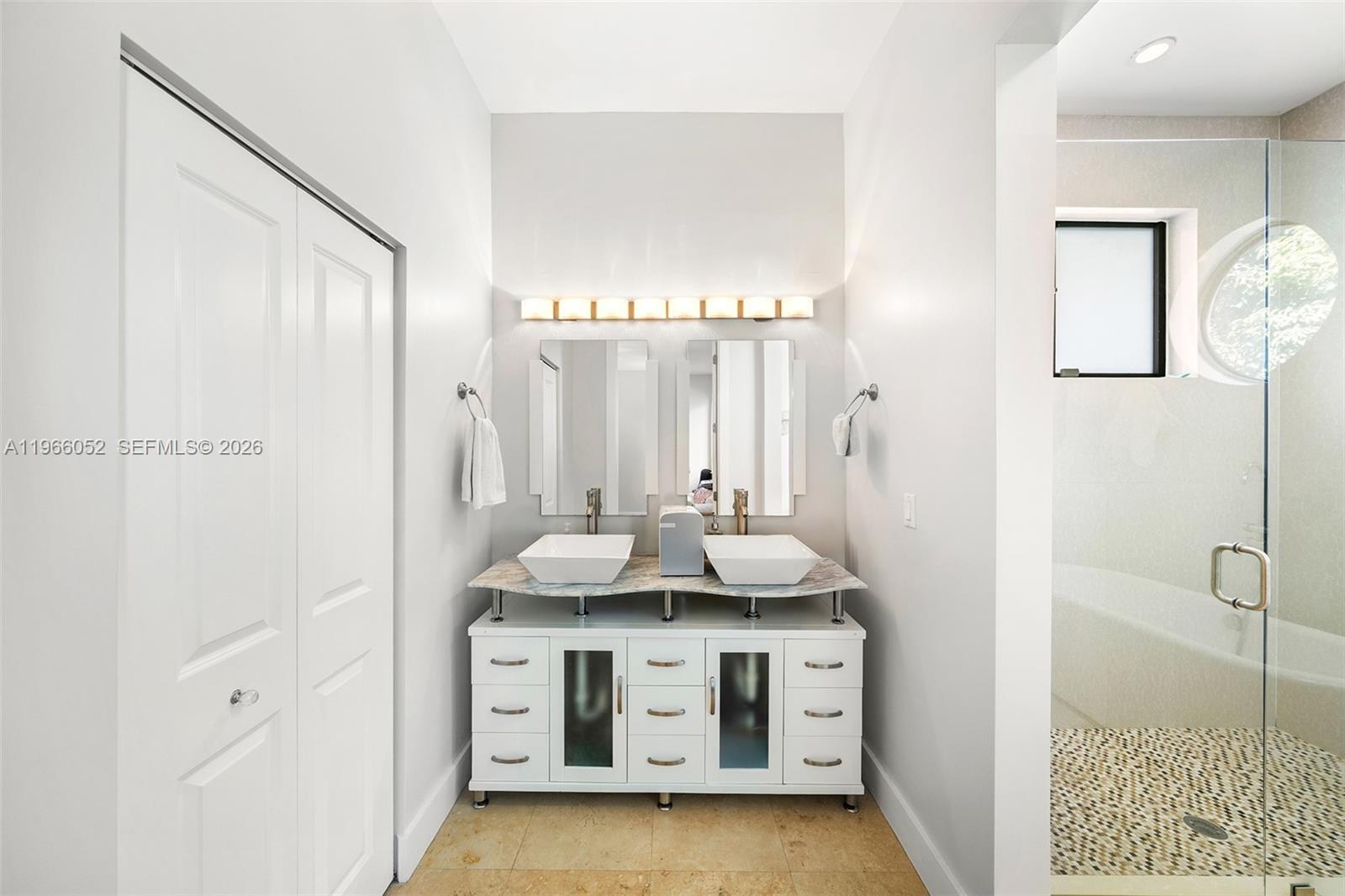 6001 Southwest 28th Street Miami, FL 33155 - Photo 19 of 30 a bathroom with a sink and a mirror