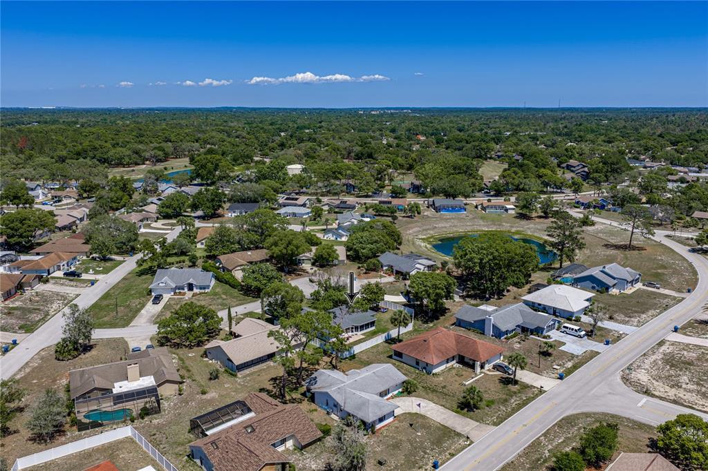 7435 Kilbride Court Weeki Wachee, FL 34613 - Photo 49 of 67 an aerial view of a city with lots of residential buildings