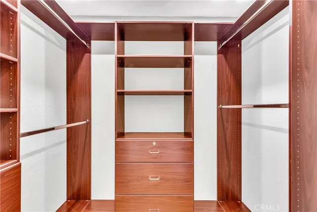 a bedroom with a large bed and a large window