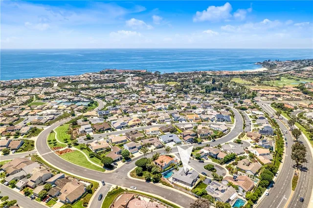an aerial view of a residential houses with city view and lake view