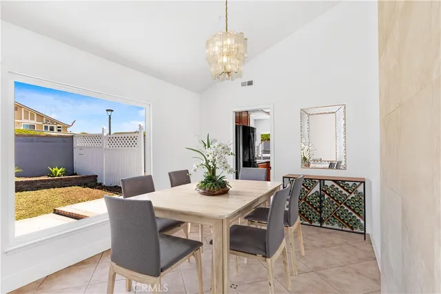 a kitchen with stainless steel appliances granite countertop wooden cabinets a granite counter top and a sink