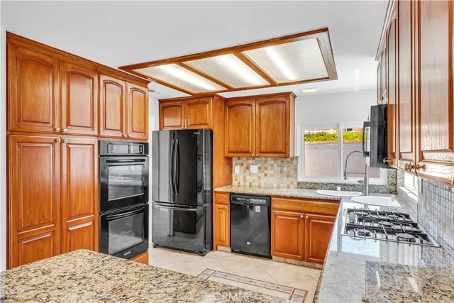 a living room with furniture potted plant and a window