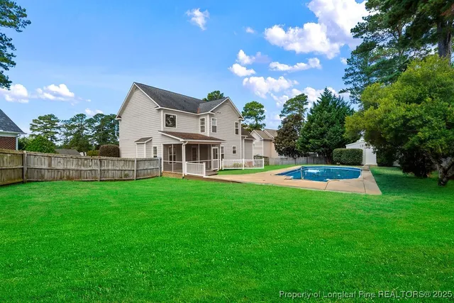 a view of a house with a yard porch and sitting area