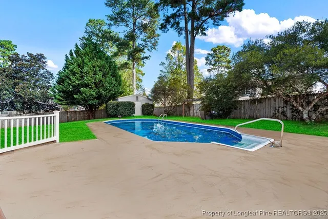 a view of a park with large trees