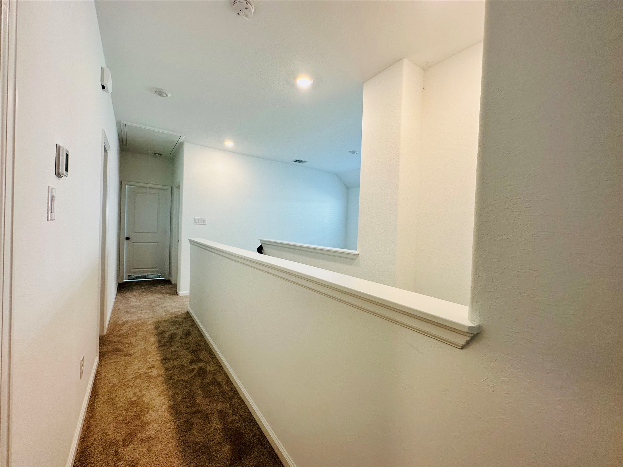 4143 Champlain Way Iowa Colony, TX 77583 - Photo 13 of 28 a view of a hallway with wooden floor