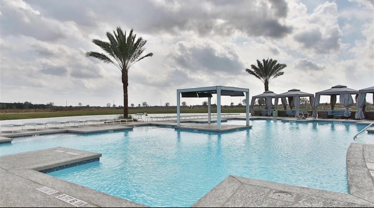 4143 Champlain Way Iowa Colony, TX 77583 - Photo 22 of 28 a view of swimming pool with outdoor seating