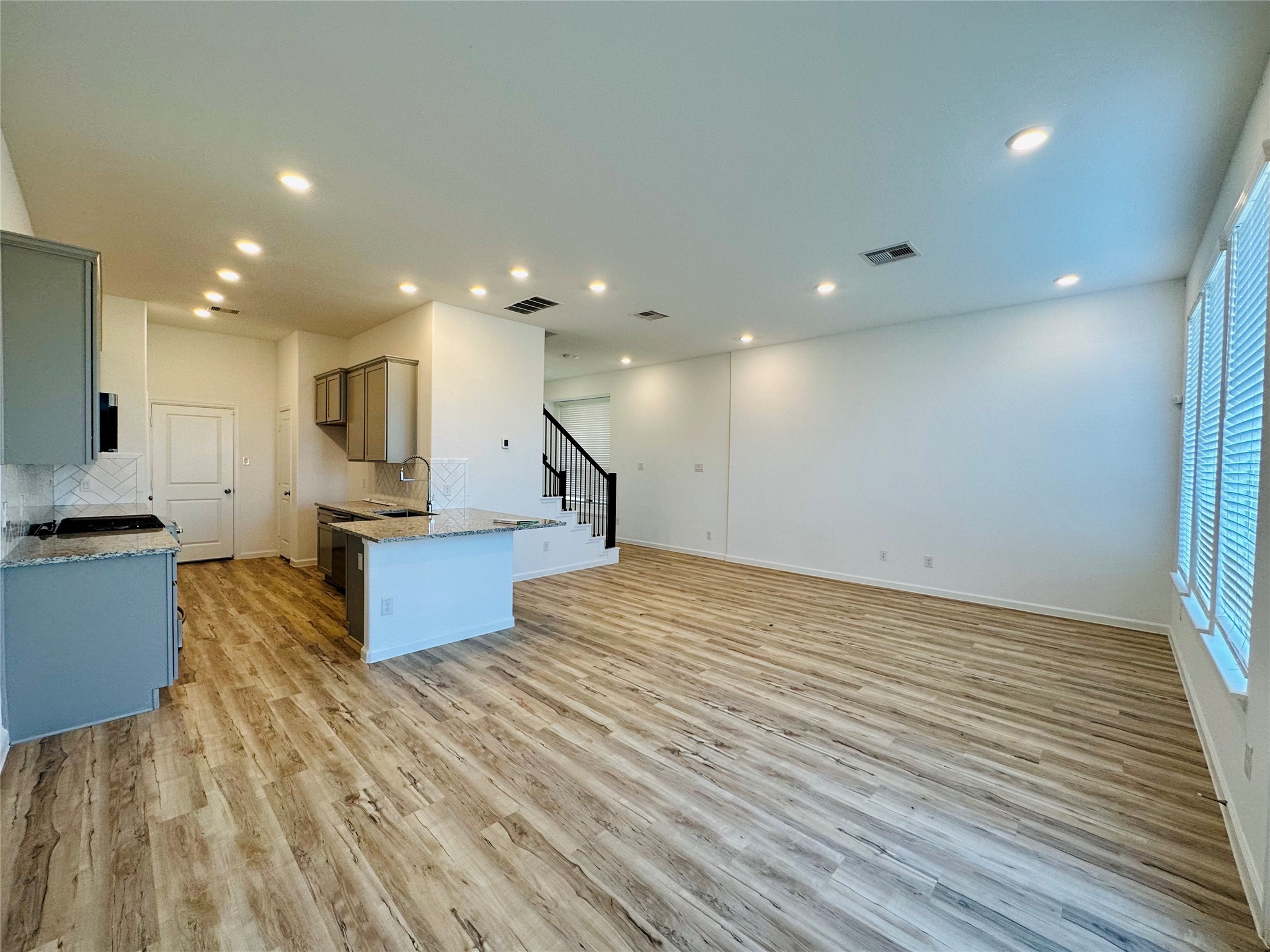 4143 Champlain Way Iowa Colony, TX 77583 - Photo 7 of 28 a view of kitchen with cabinets and wooden floor