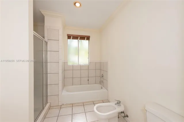 a bathroom with a bathtub and a toilet