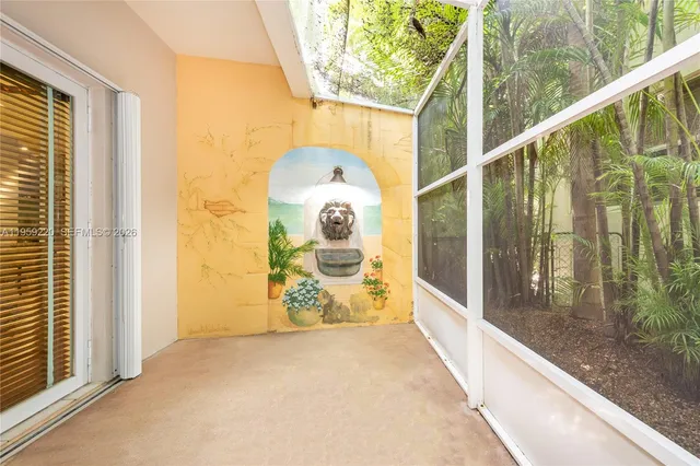 a view of a glass door with a balcony