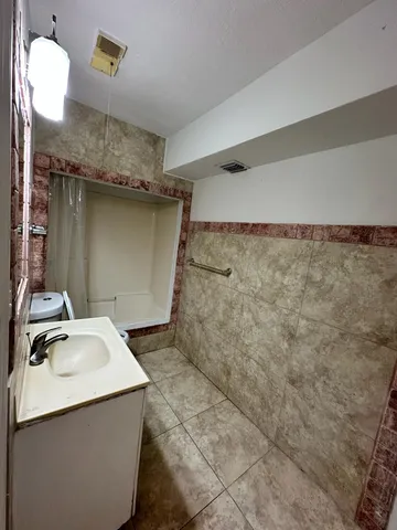 a bathroom with a sink and mirror