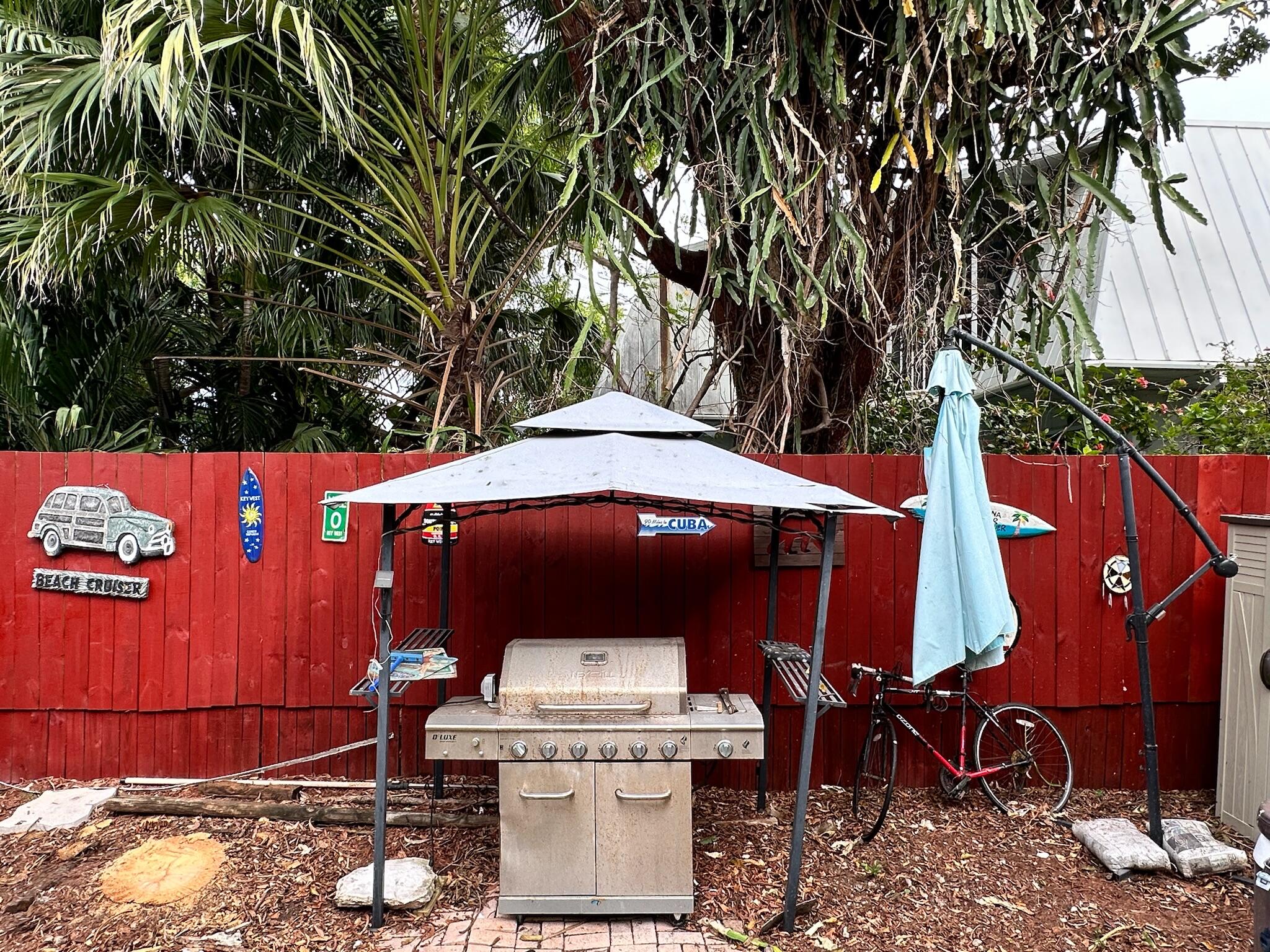 3210 Eagle Avenue Key West, FL 33040 - Photo 23 of 35 a view of a backyard with furniture and a grill
