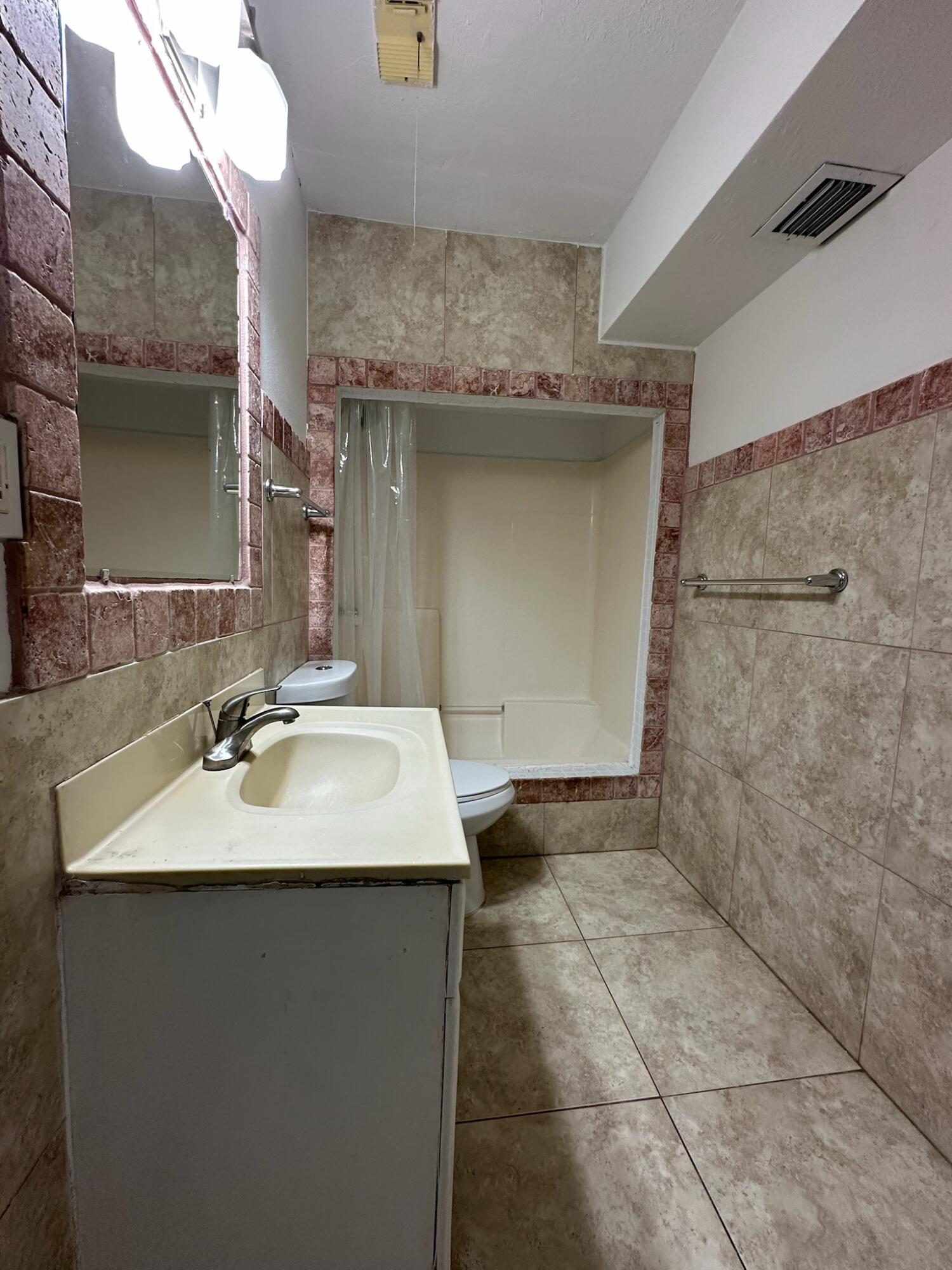 3210 Eagle Avenue Key West, FL 33040 - Photo 30 of 35 a bathroom with a sink and a mirror