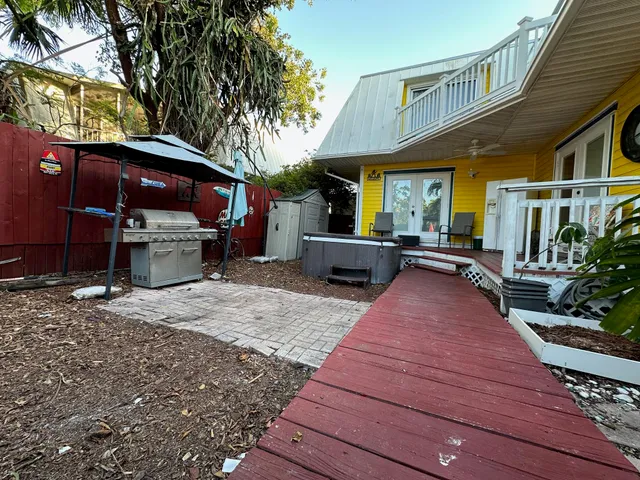 a view of a house with wooden deck