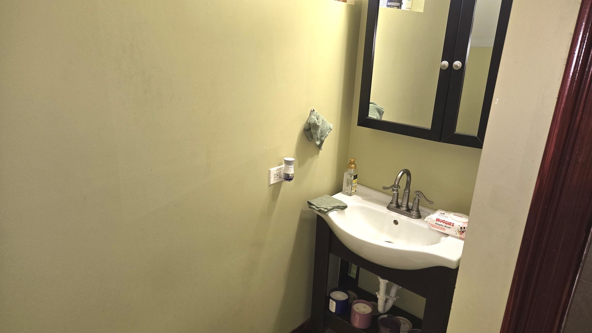 3352 West 84th Street Chicago, IL 60652 - Photo 16 of 26 a bathroom with a sink and a mirror