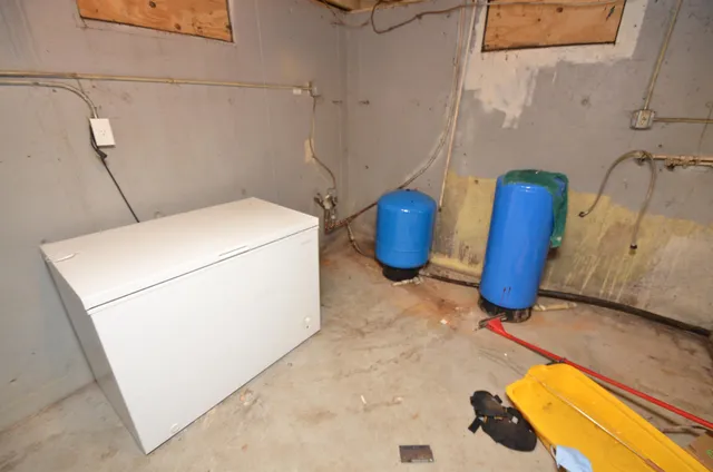 a view of storage and utility room with washer and dryer