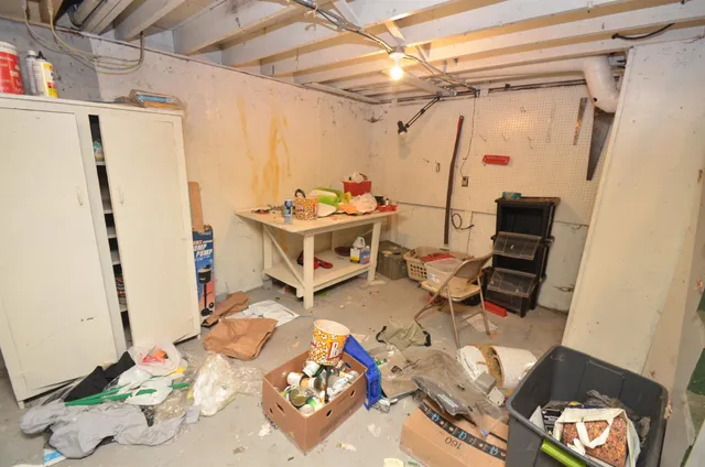 a room with gym equipment and view of living room