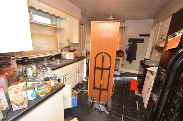 a bathroom with a sink mirror vanity and shower
