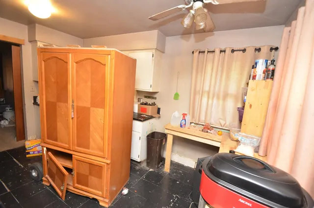 a room with a bed and a chandelier