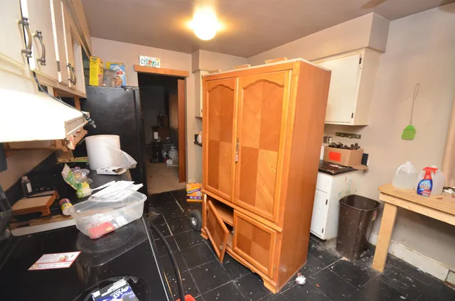 a bathroom with a sink a toilet and shower curtain