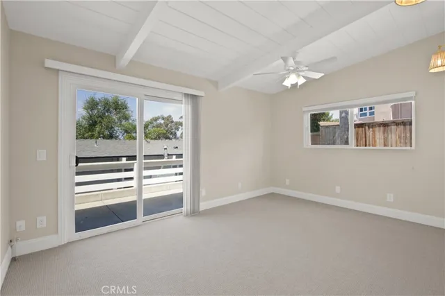 an empty room with a empty space and windows