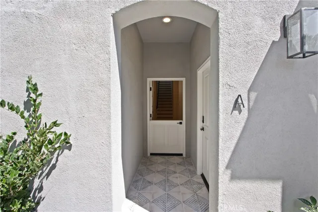 a view of a hallway view with staircase