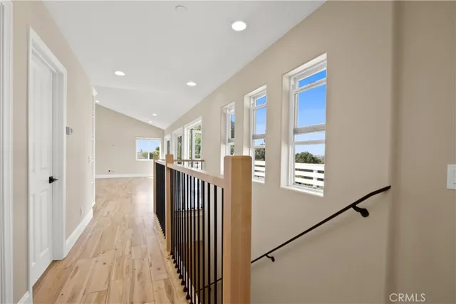 a view of a hallway with windows