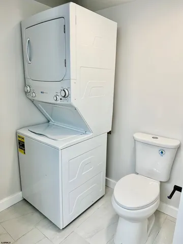 a bathroom with a toilet and a mirror