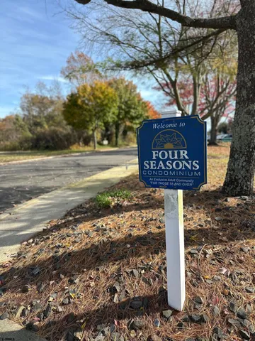 a sign board on the side of the road
