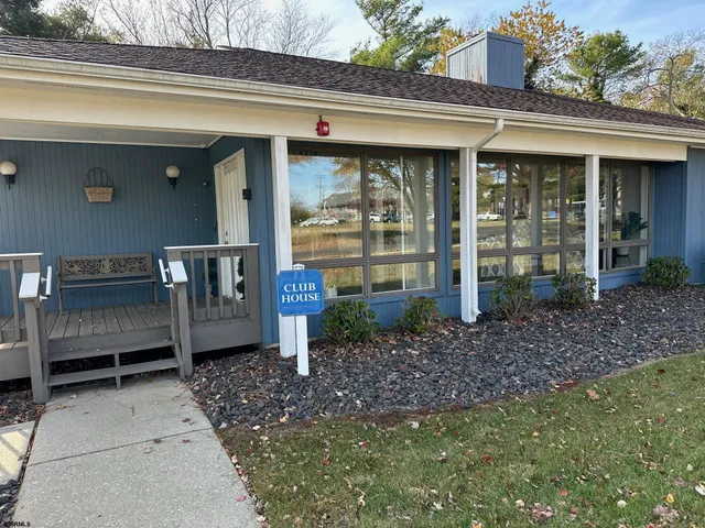 a front view of a house with a porch