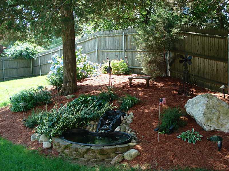 74 Scarborough Road Cumberland, RI 02864 - Photo 5 of 20 Yard/Garden. Garden waterfall