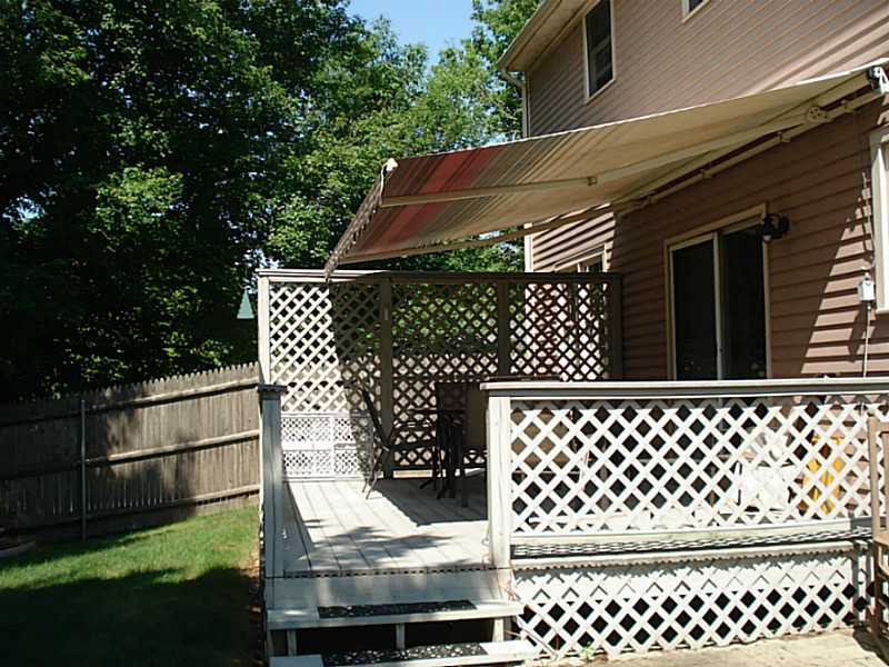 74 Scarborough Road Cumberland, RI 02864 - Photo 6 of 20 Patio/Deck. Deck which overlooks the garden. Retractable Sunsetter awning allows for sun or shade.