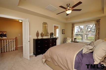 2430 Pecan Ridge Way Apex, NC 27502 - Photo 17 of 23 Double doors leading into the owner's suite for an extra-special feel! Not actual home - photo is of model home.