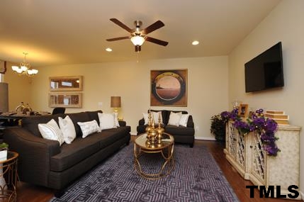 2430 Pecan Ridge Way Apex, NC 27502 - Photo 7 of 23 Look at the large furniture in this family room, and there is still plenty of space! Not actual home - photo is of model home.