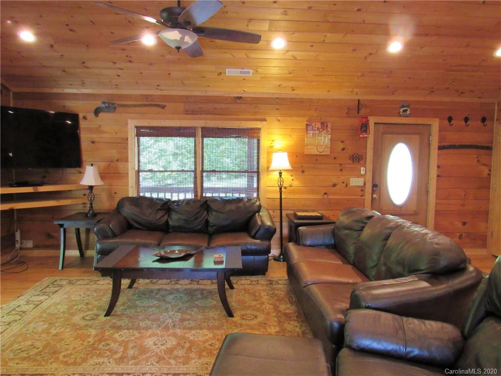405 Front Ridge Circle, Unit 62 Rutherfordton, NC 28139 - Photo 14 of 30 a living room with furniture and a flat screen tv