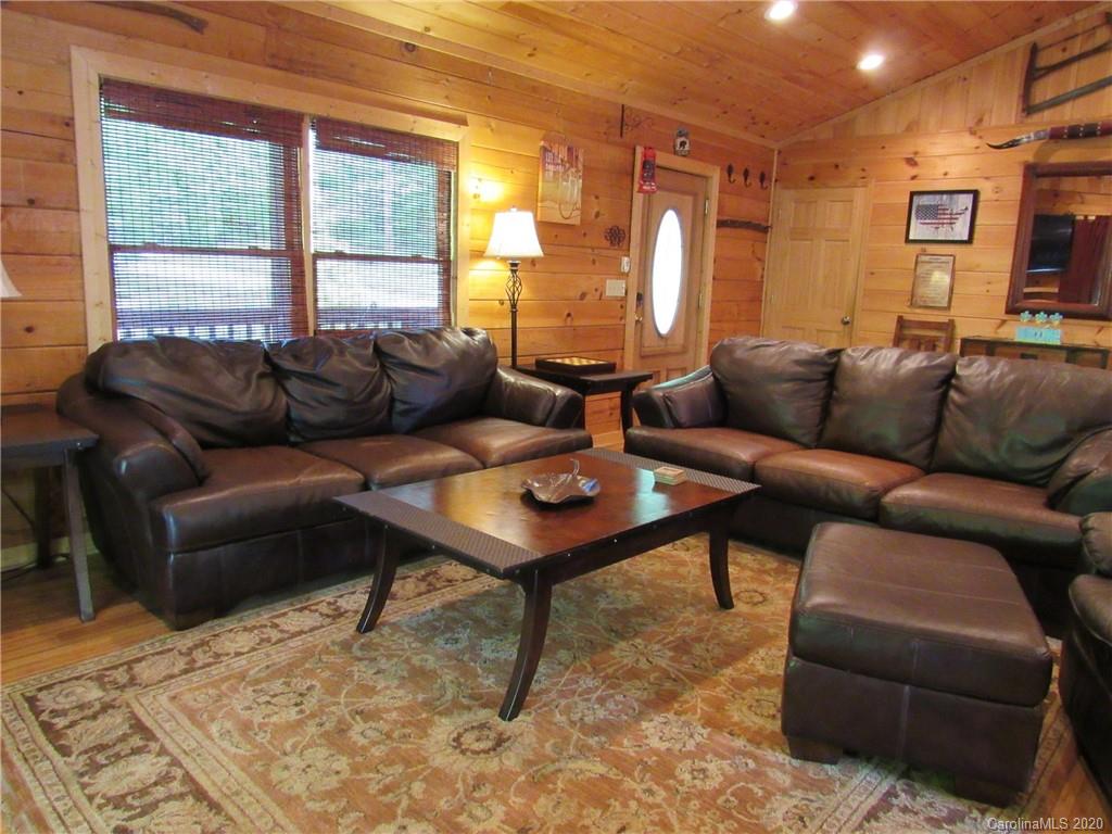 405 Front Ridge Circle, Unit 62 Rutherfordton, NC 28139 - Photo 15 of 30 a living room with furniture lamp and a table