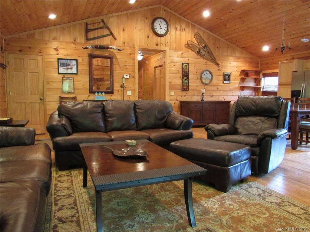 405 Front Ridge Circle, Unit 62 Rutherfordton, NC 28139 - Photo 16 of 30 a living room with furniture and a clock