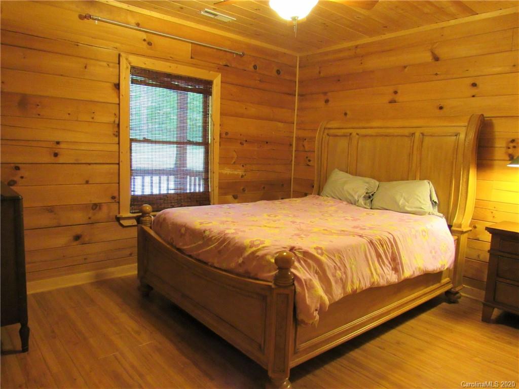 405 Front Ridge Circle, Unit 62 Rutherfordton, NC 28139 - Photo 19 of 30 a bed sitting in a bedroom next to a window