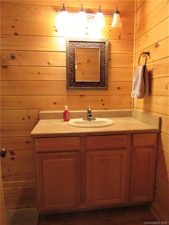 405 Front Ridge Circle, Unit 62 Rutherfordton, NC 28139 - Photo 20 of 30 a bathroom with a sink and a mirror