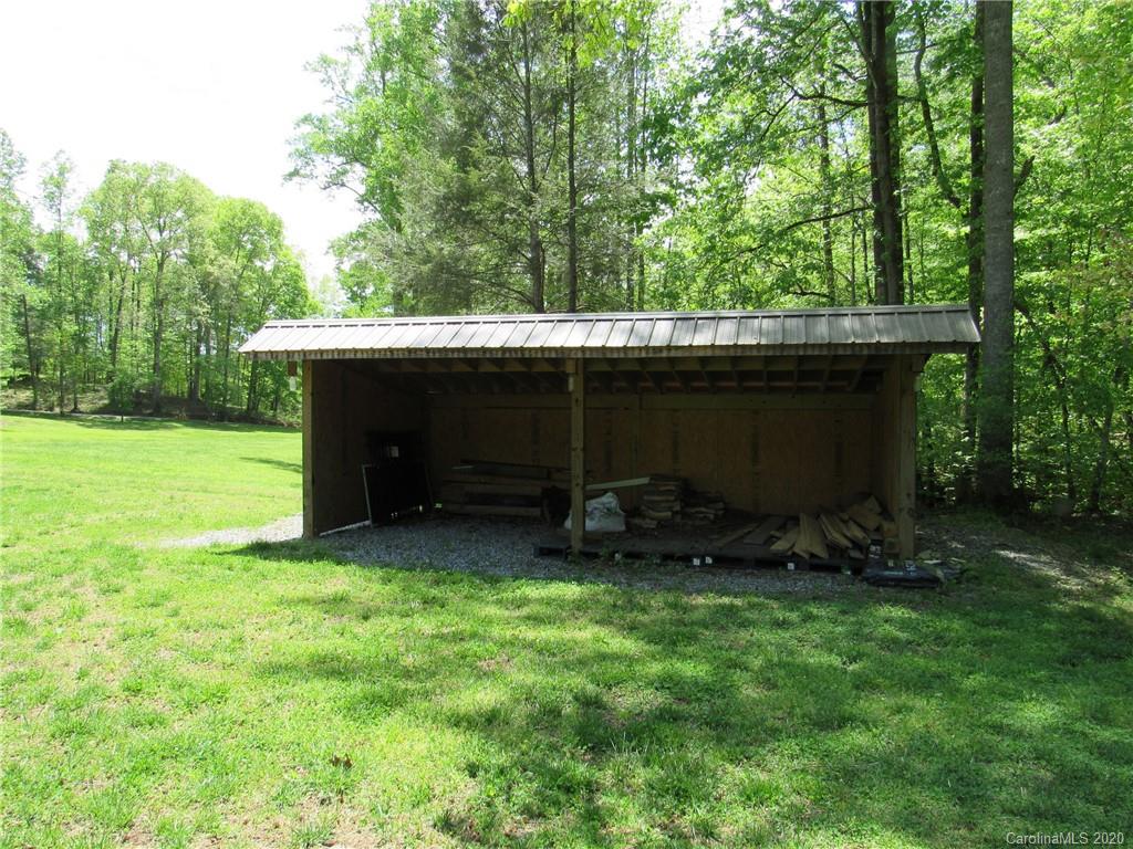 405 Front Ridge Circle, Unit 62 Rutherfordton, NC 28139 - Photo 6 of 30 a view of backyard with a barn and large trees