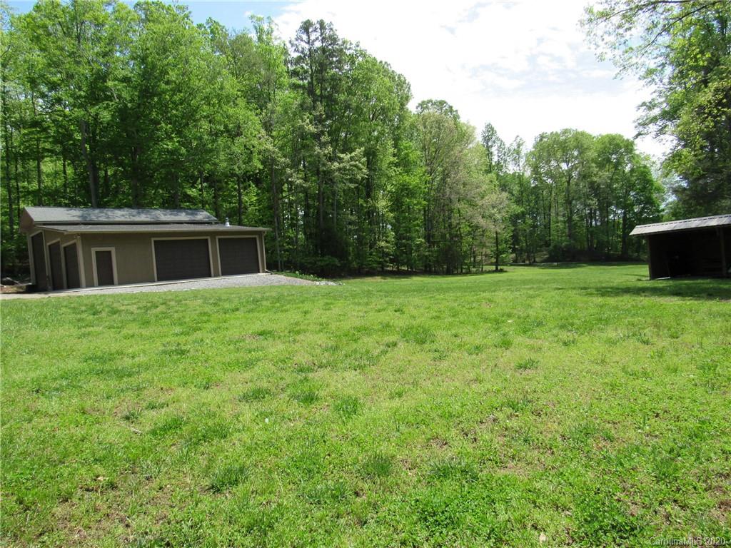 405 Front Ridge Circle, Unit 62 Rutherfordton, NC 28139 - Photo 8 of 30 a backyard of a house with lots of green space