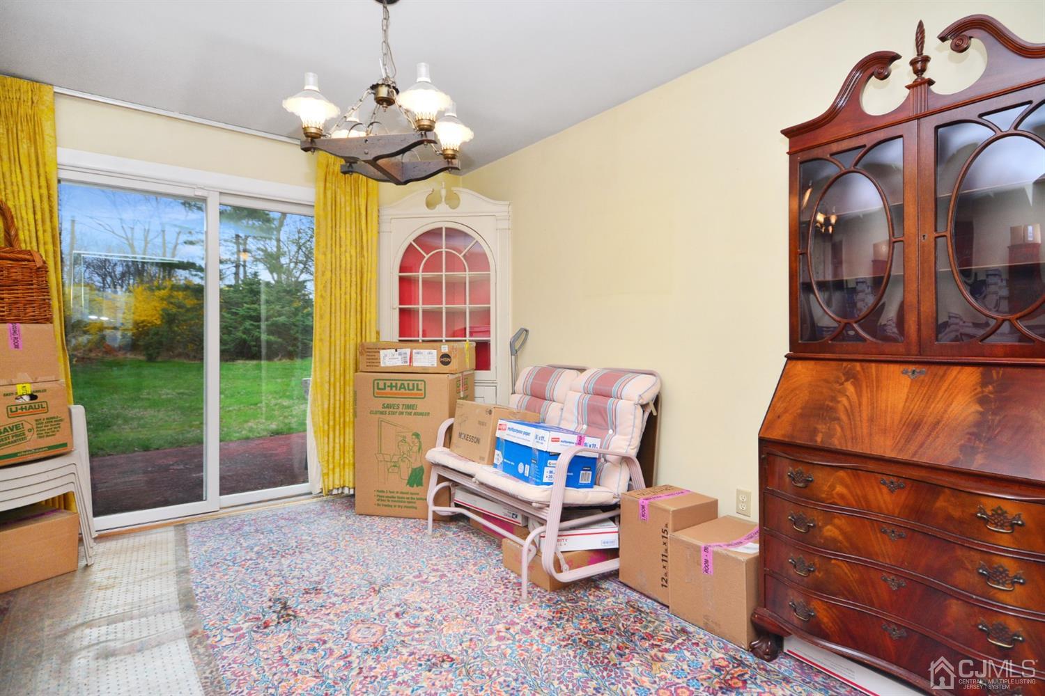 1776 Mountain Top Road Bridgewater, NJ 08807 - Photo 8 of 27 a living room with fireplace furniture and a floor to ceiling window