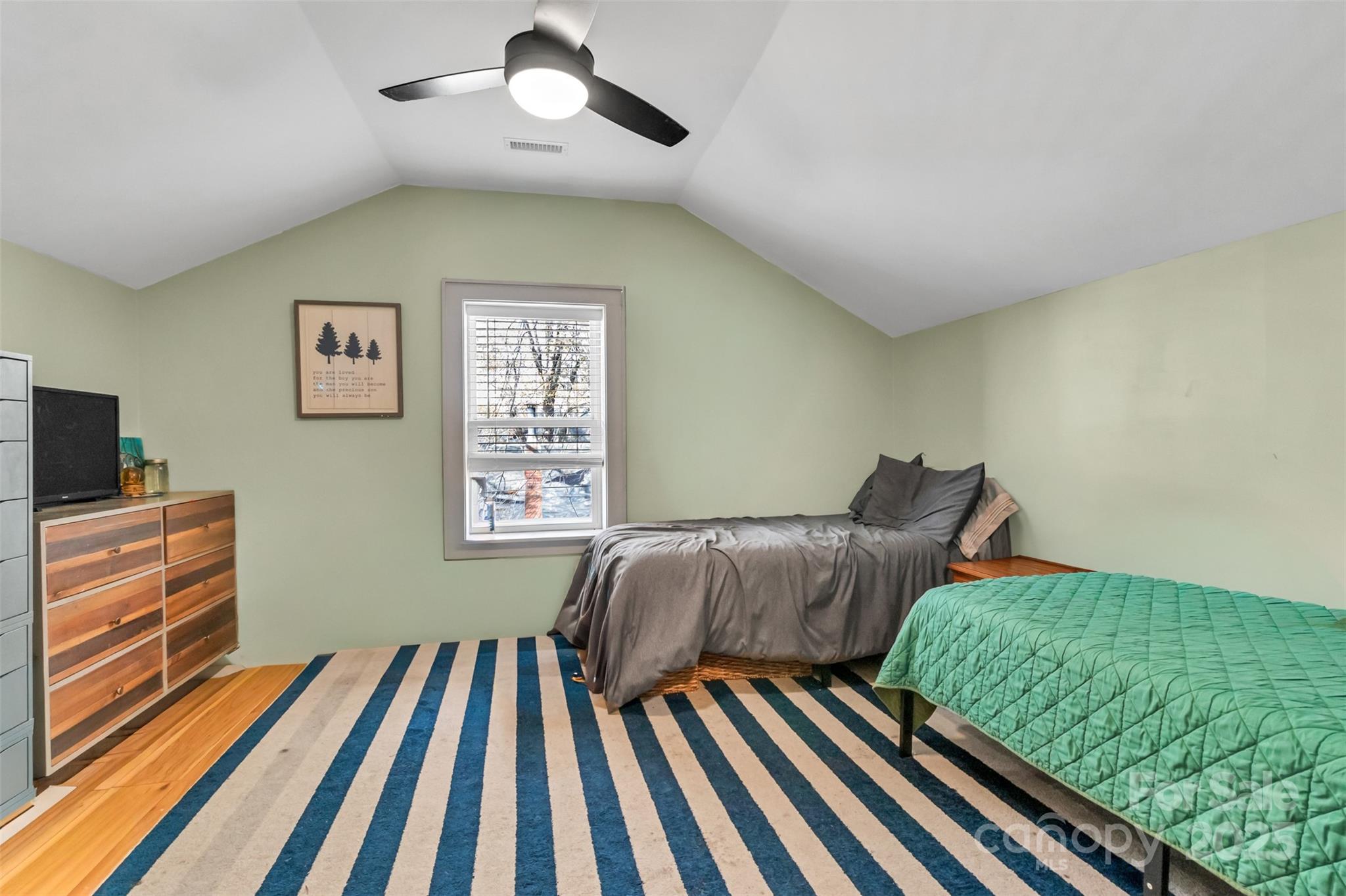 113 Marion Street Clover, SC 29710 - Photo 19 of 26 a bedroom with furniture and a flat screen tv