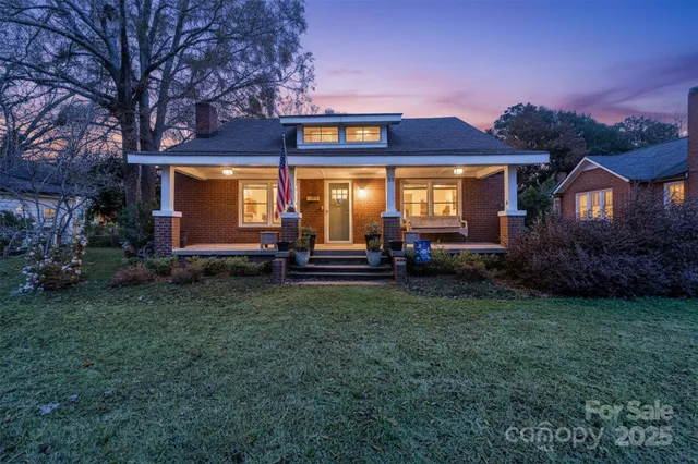 a view of a house with garden and porch
