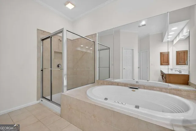 a bathroom with a bathtub and a shower