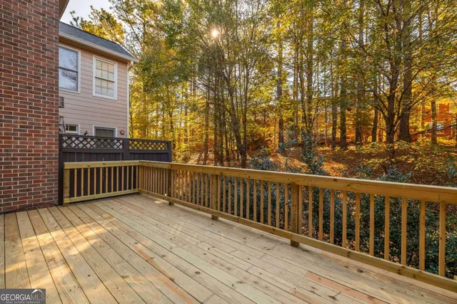 a view of deck with wooden floor and fence