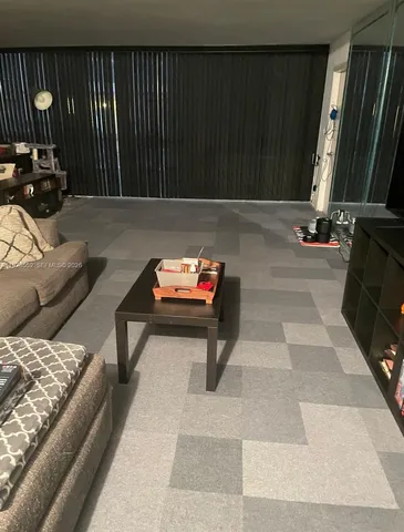 a view of wooden floor and windows in a room