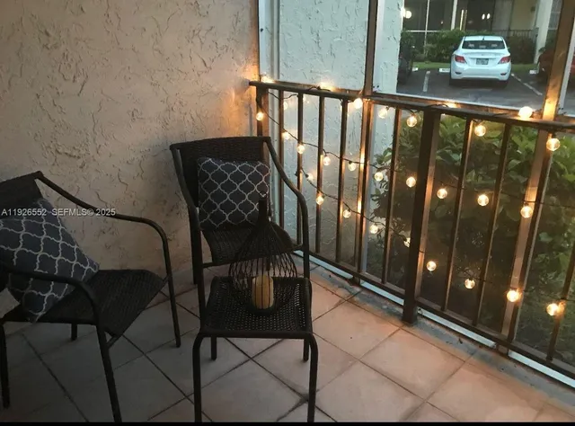 a view of a balcony with furniture