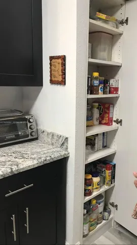 a kitchen with a refrigerator and a stove