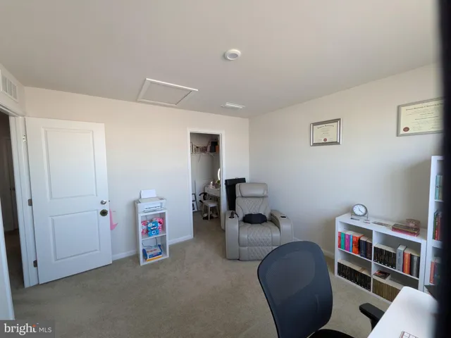 a view of a livingroom with furniture and toys